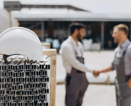 a-manager-and-an-employee-shake-hands-next-to-a-ca-2025-02-16-19-15-09-utc