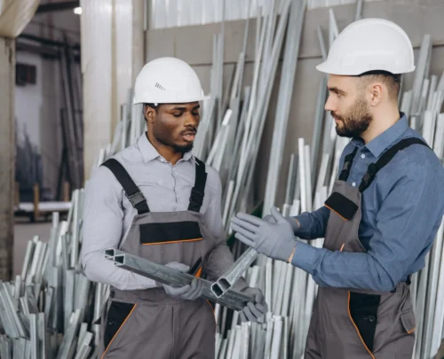 factory-workers-discussing-aluminum-profiles-for-w-2025-02-17-00-42-01-utc